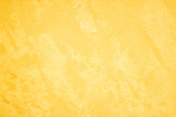 Yellow concrete stone texture for background in summer wallpaper. Cement and sand wall of tone vintage minimal. Concrete abstract wall of light yellow color, cement texture white blank for home decor.