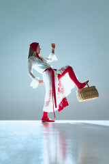 Woman resting foot atop basket, fingers delicately raised, body elongated, symbolizing balance...