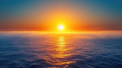 Obraz premium Sunset over the ocean scenic view with vibrant sky and dramatic dusk concept. A breathtaking sunset over a calm ocean creating serene reflections.