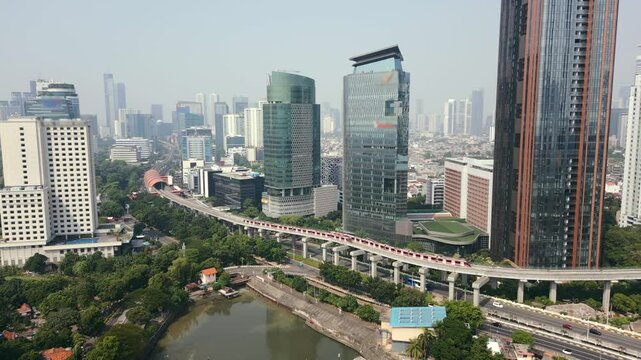 Aerial view of skytrain and city traffic in the business district of Jakarta, Indonesia