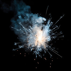A vibrant sparkler creating a stunning display of light and sparks against a dark backdrop.