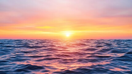 Fototapeta premium Sunset over the ocean scenic view with vibrant sky and dramatic dusk concept. Vibrant sunset over calm ocean waves, creating a serene atmosphere.