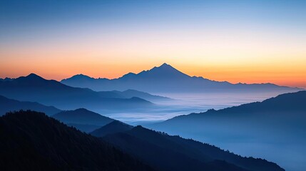 Obraz premium Sunset over the ocean scenic view with vibrant sky and dramatic dusk concept. Breathtaking view of mountains at sunset with misty valleys.