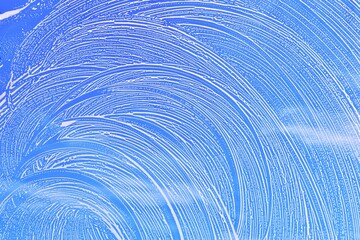 Soap background texture on window glass.