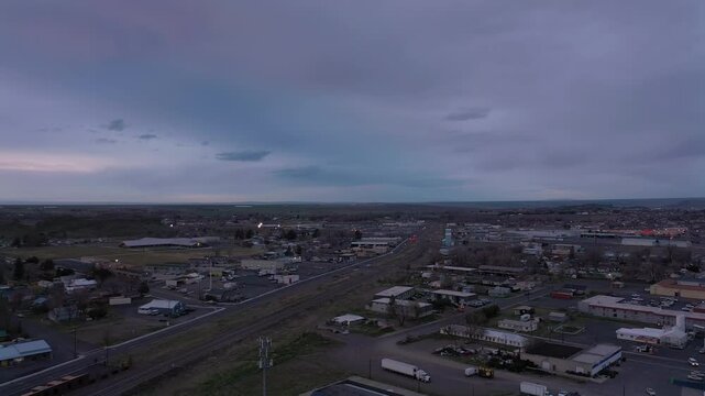Hermiston, Eastern Oregon. Slow drone backwards panning shot of town.