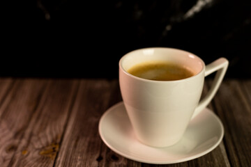 A cup of coffee on the table. Coffee in a coffee shop.