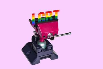 Conceptual illustration: the word “LGBT” tightly clamped in a carpenter’s vice on pink background — symbolizing societal pressure, discrimination, and restriction of lgbt rights.