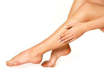 Fototapeta premium Woman's smooth legs and feet showcasing soft and well-maintained skin.