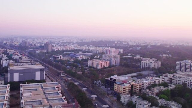 Sri Ram Garden by Jains apartments with crowded buildings and sky at suchitra, hyderabad, telangana, india. day time, moving up, drone shot, 4k.