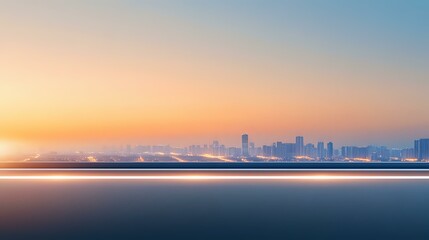 Obraz premium Minimalist cityscape silhouette at sunset with calm ocean waters in foreground, soft orange and blue gradient sky creates peaceful urban panorama.