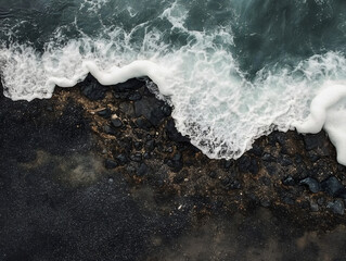 Obraz premium Aerial View of Ocean Waves on Rocky Shore