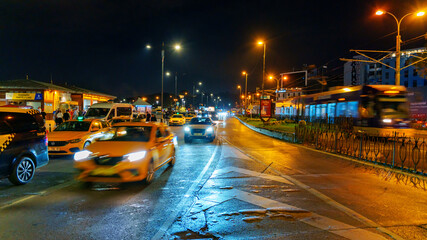 traffic on city road at night, cityscape, cars and buses on urban street, Istanbul, Turkey
