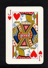 Obraz premium A vintage playing card in the suit of hearts isolated on a black background.
