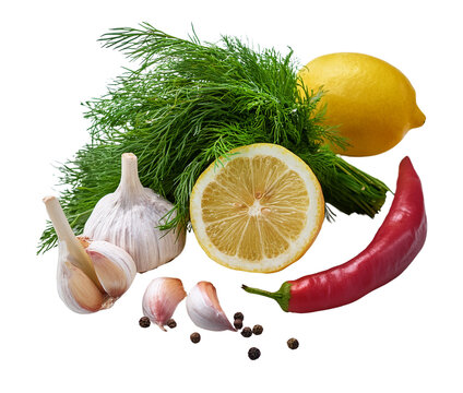 Fresh Flavors: An appealing still life featuring garlic cloves, lemons, dill, a red chili pepper, and black peppercorns, creating a beautiful composition of fresh ingredients.