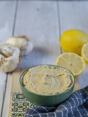 Nice bowl of hummus, a traditional Middle Eastern vegetarian dish made from chickpeas.