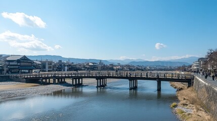 A traditional wooden bridge crossing a serene river in Kyoto's historic district