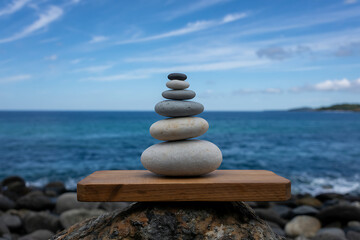 Fototapeta premium Concept of Harmony and Balance – Stacked Stones Against the Sea, Tranquil Nature and Mindfulness Visualization