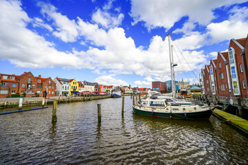 Obraz premium View of the Husumer Au in Husum on the North Frisian North Sea coast. The old town with historic buildings. 
