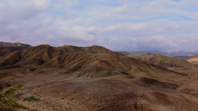 Aerial ascending view of Calanchi del Cannizzola (or Deserto dei Calanchi), known as the &ldquo;Sicilian desert&rdquo;, a series of clay formations in the East part of Sicily