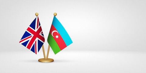 Obraz premium UK vs Azerbaijan desk flags mockup 3d illustration. Versus flag of United Kingdom of Great Britain