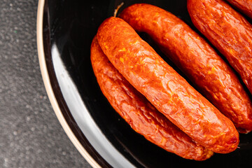 Smoked sausages pork meat beef dish fresh gourmet food background on table rustic food top view copy space