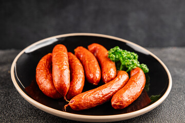 Smoked sausages pork meat beef dish fresh gourmet food background on table rustic food top view copy space