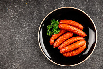 Smoked sausages pork meat beef dish fresh gourmet food background on table rustic food top view copy space