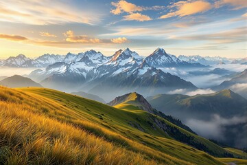 Obraz premium Majestic mountain landscape with golden grassy hills and misty valleys.