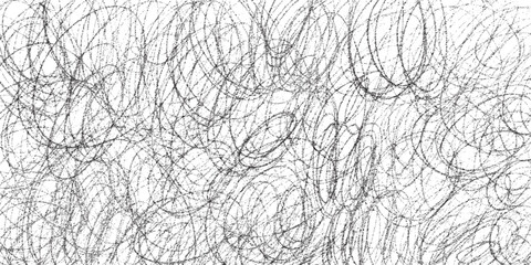 Grunge pencil doodle pattern background in black and white.