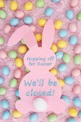 Closed for Easter sign with bunny and candy eggs