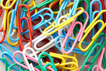 Colorful Close up of Paper Clips Showcasing Vibrant Textures in Various Hues on White and Isolated Background