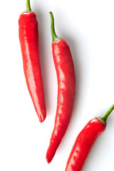 Close up of Red Chili Peppers Showcasing Texture and Vibrant Colors on White and Isolated Background