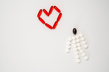 pills laid out in the shape of a man