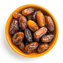 Obraz premium Dried dates in orange bowl, top view, white background (1)