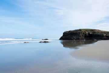 Tranquil scene with low tide at Cathedrals beach. Sunny day. No people.