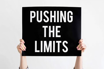 Pushing The Limits text on card, concept background.
