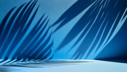 Abstract blue background with shadow of palm leaves for the presentation of a cosmetic product. A scene with a geometric backdrop. Podium for product promotion, beauty, natural eco cosmetic. Showcase.