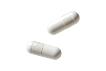 white falling pills isolated on white or transparent png