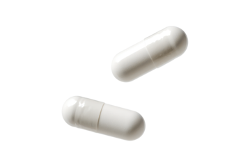 white falling pills isolated on white or transparent png