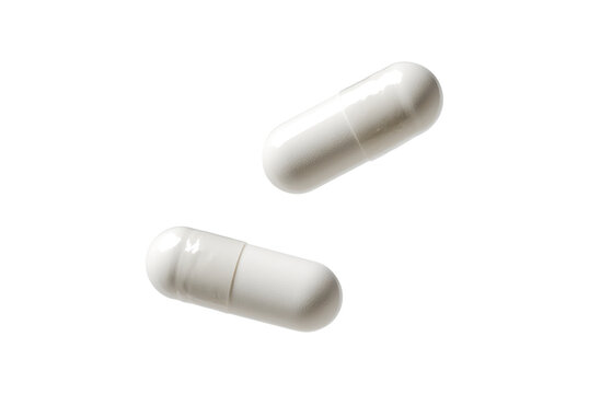 white falling pills isolated on white or transparent png