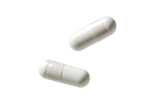 white falling pills isolated on white or transparent png