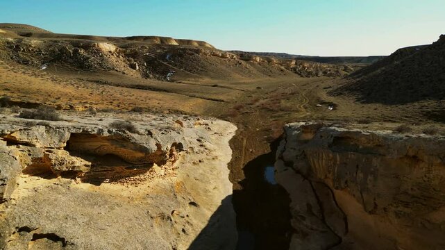 take off from a narrow dry rocky canyon with tafoni kazakhstan 4k
