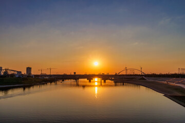 Fototapeta premium Sundown view of the Spiegelwaal water reserve area next to the river Waal in Nijmegen, The Netherlands