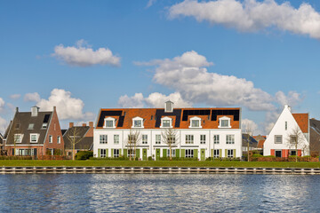 White family homes with solar panels located on the Veluwemeer waterfront
