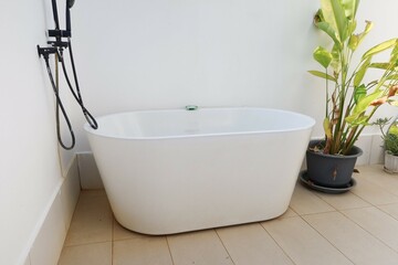 modern bathroom with bathtub and bath