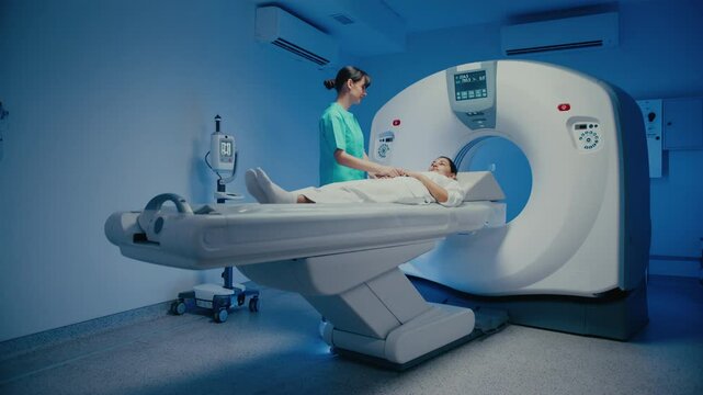Dedicated MRI specialist adjusting head position of female patient before diagnostic scan. Preparing equipment and ensuring comfort while operating advanced imaging machine in hospital setting.