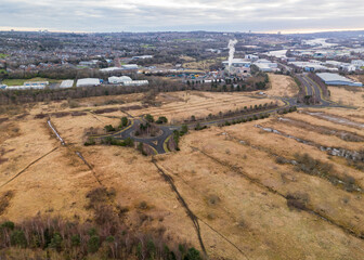 Naklejka premium Newcastle UK: 2nd March 2025: Newburn Business Park development with loads of empty land and roads to nowhere drone footage