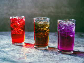 A lot of Soft drinks in colorful and flavorful glasses on the table,Glasses with sweet drinks with...