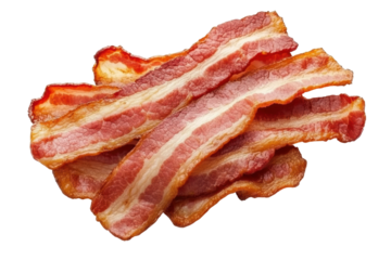 Crispy cooked bacon slices piled on black background, cut out