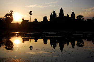 Naklejka premium Ancient ruins antique building castle Khmer Empire of Angkor Wat city temple for cambodian people foreign travelers travel visit respect praying and looking landscape sunrise in Siem Reap, Cambodia